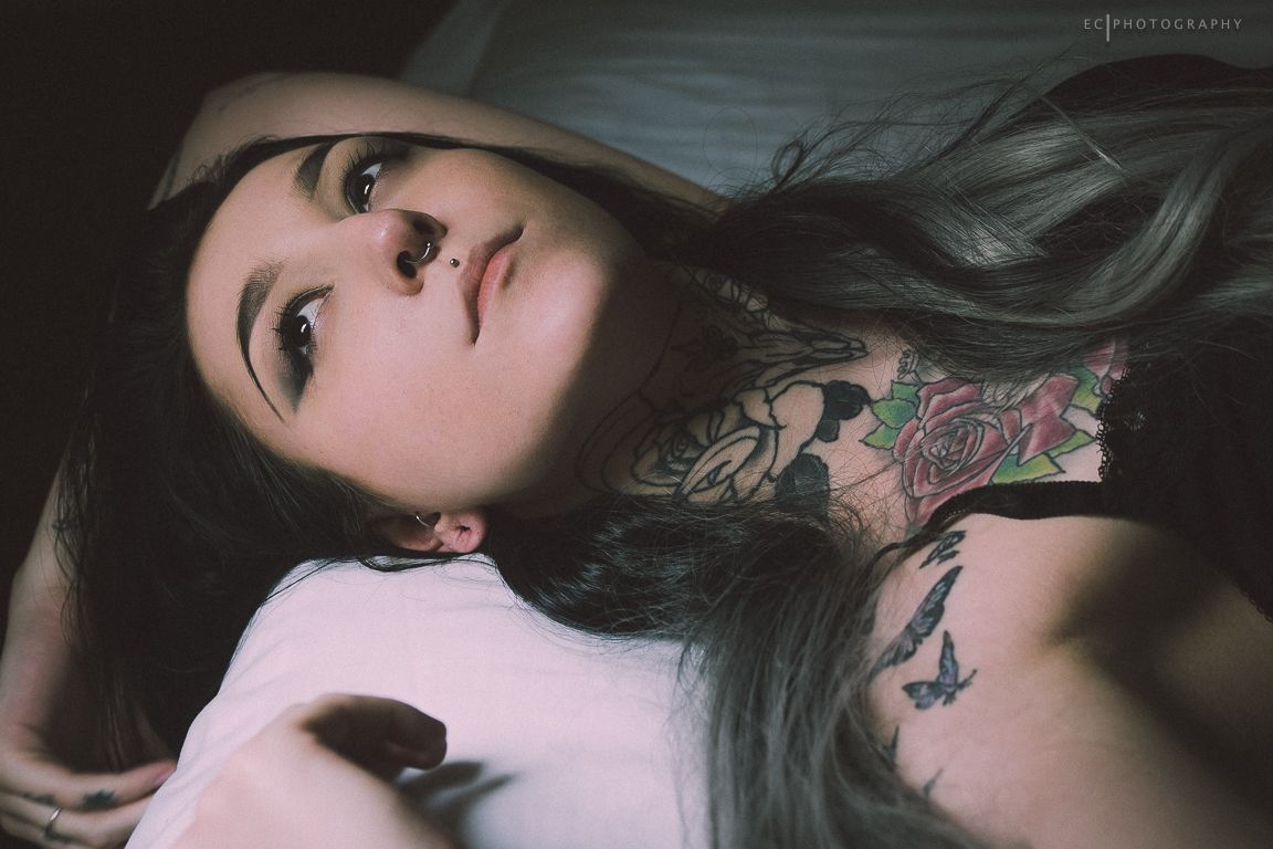 A moody artistic photo series showing dark hair flowing dramatically across pale sheets.