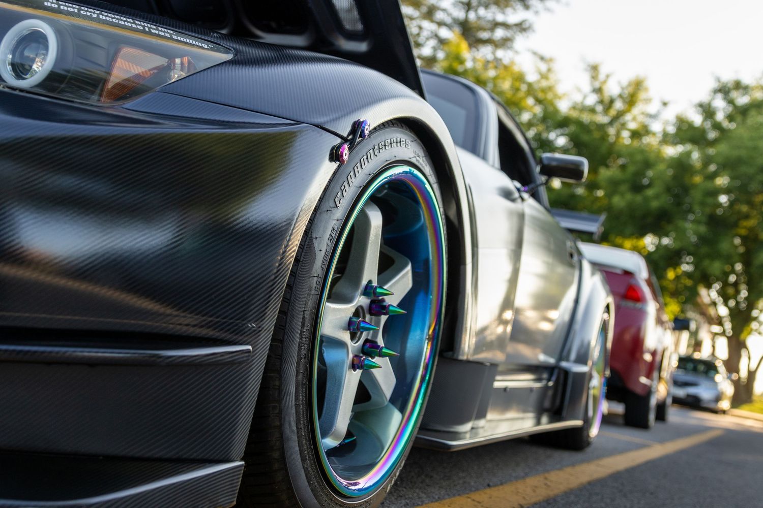 Close-up artistic detail shots of modified car wheels and suspension components.
