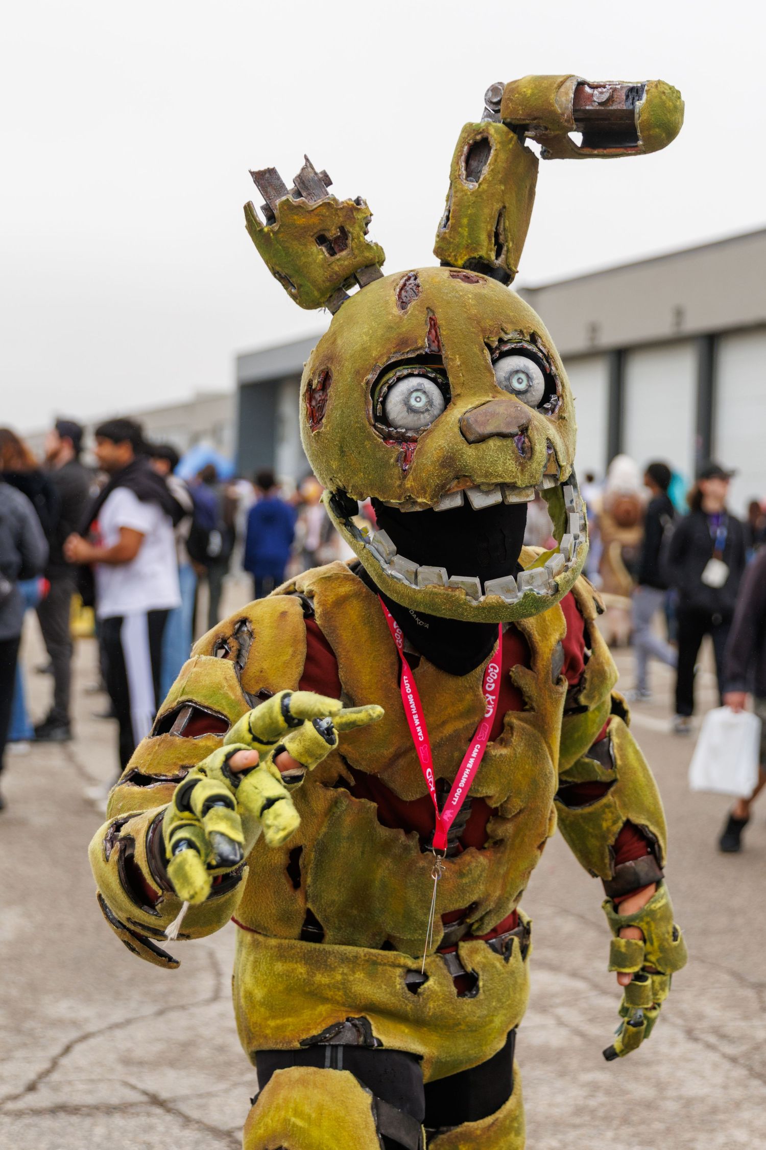 Detailed Springtrap costume from Five Nights at Freddys with distressed yellow animatronic suit at convention.