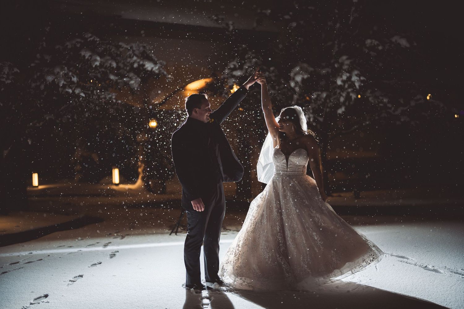 A beautiful winter wedding scene with snow and soft lighting in the background.