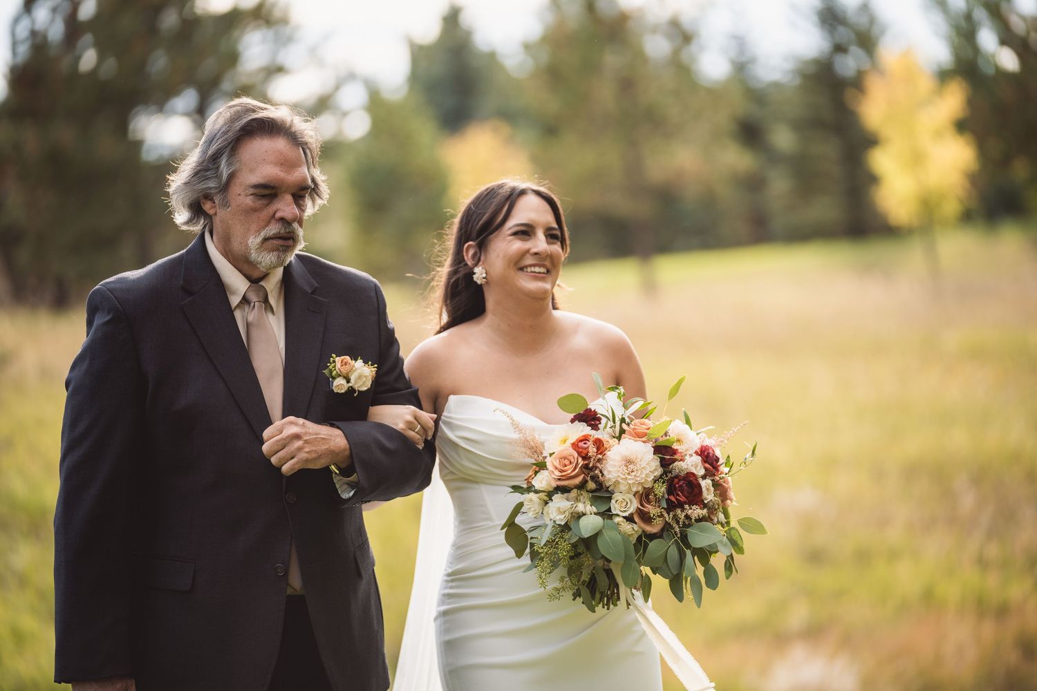 Fall wedding celebration captured in outdoor setting with natural autumn colors.