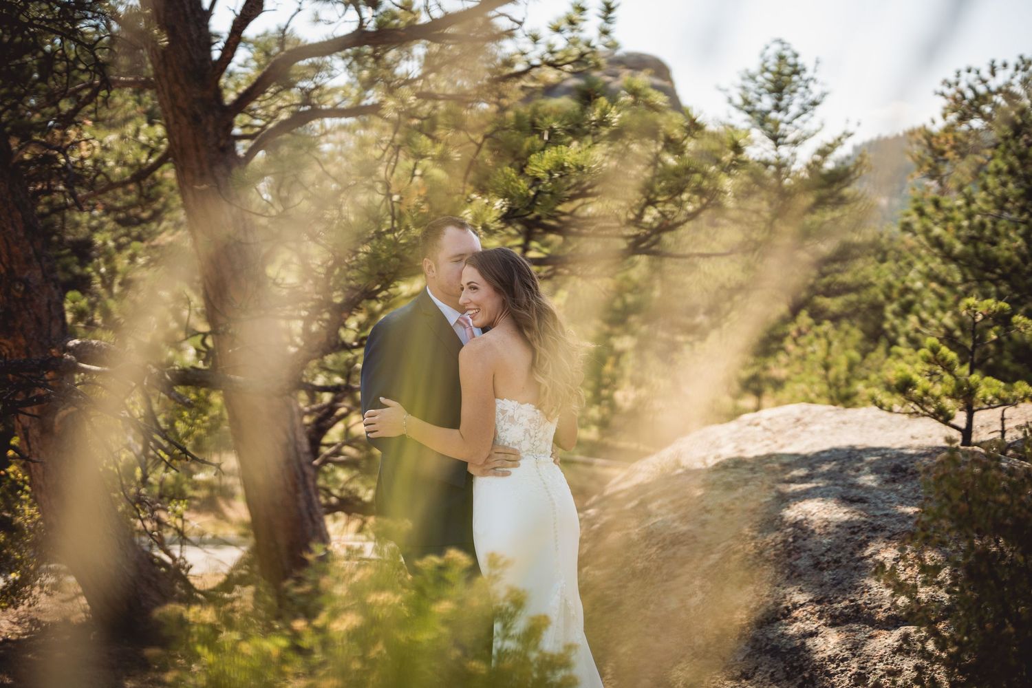 Wedding photography sequence in a sunlit mountain forest setting with golden light filtering through trees.