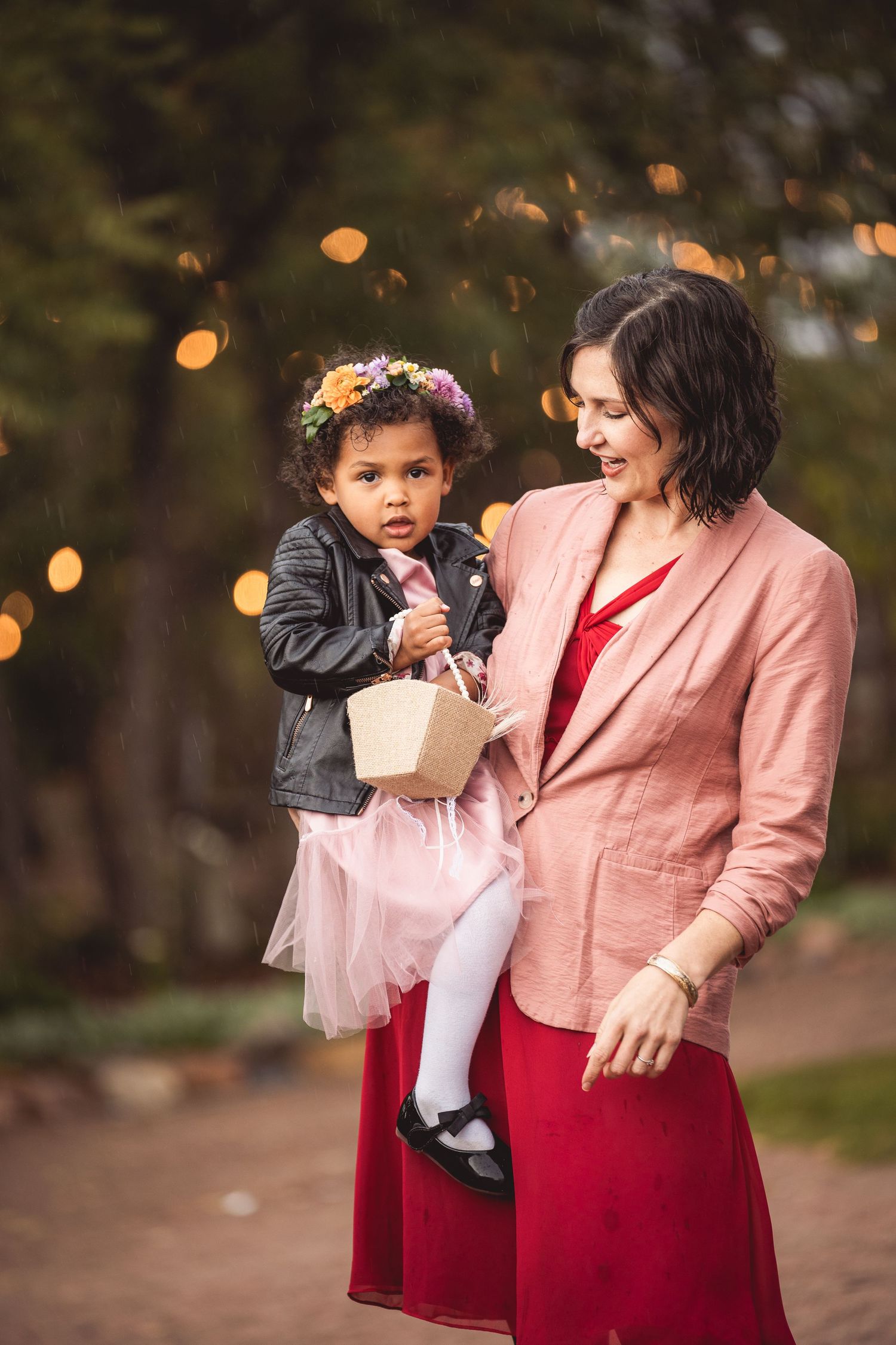 Candid moment of two people enjoying snacks outdoors in autumn setting.