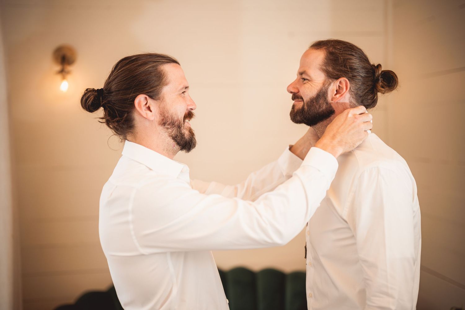 Two people in white shirts practicing dance moves in studio setting.