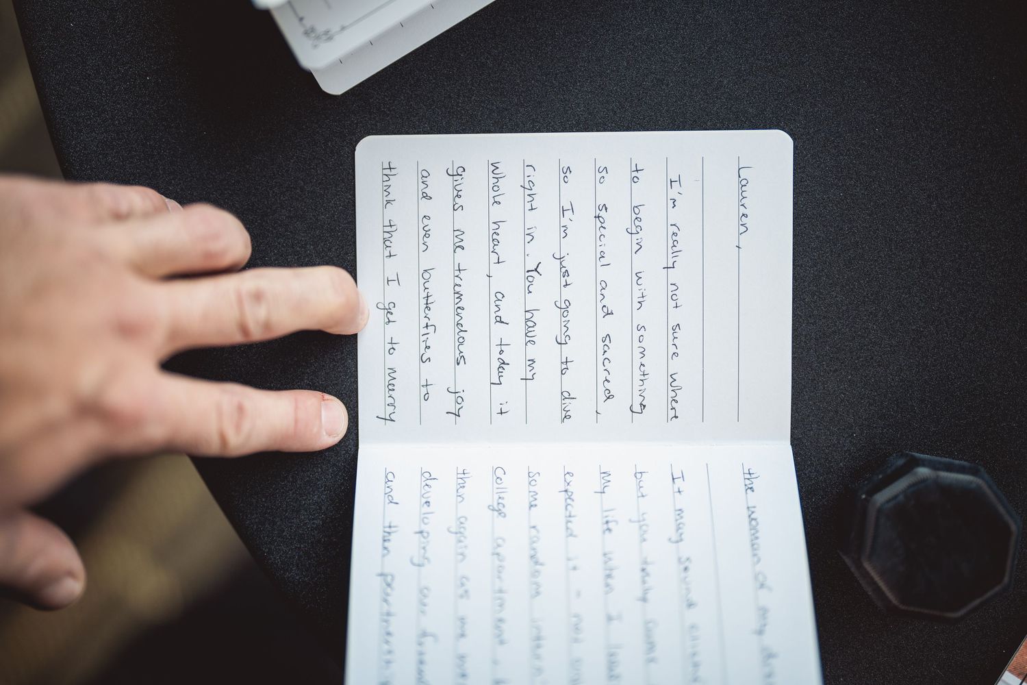 Handwritten wedding vows or notes displayed in a personal journal.