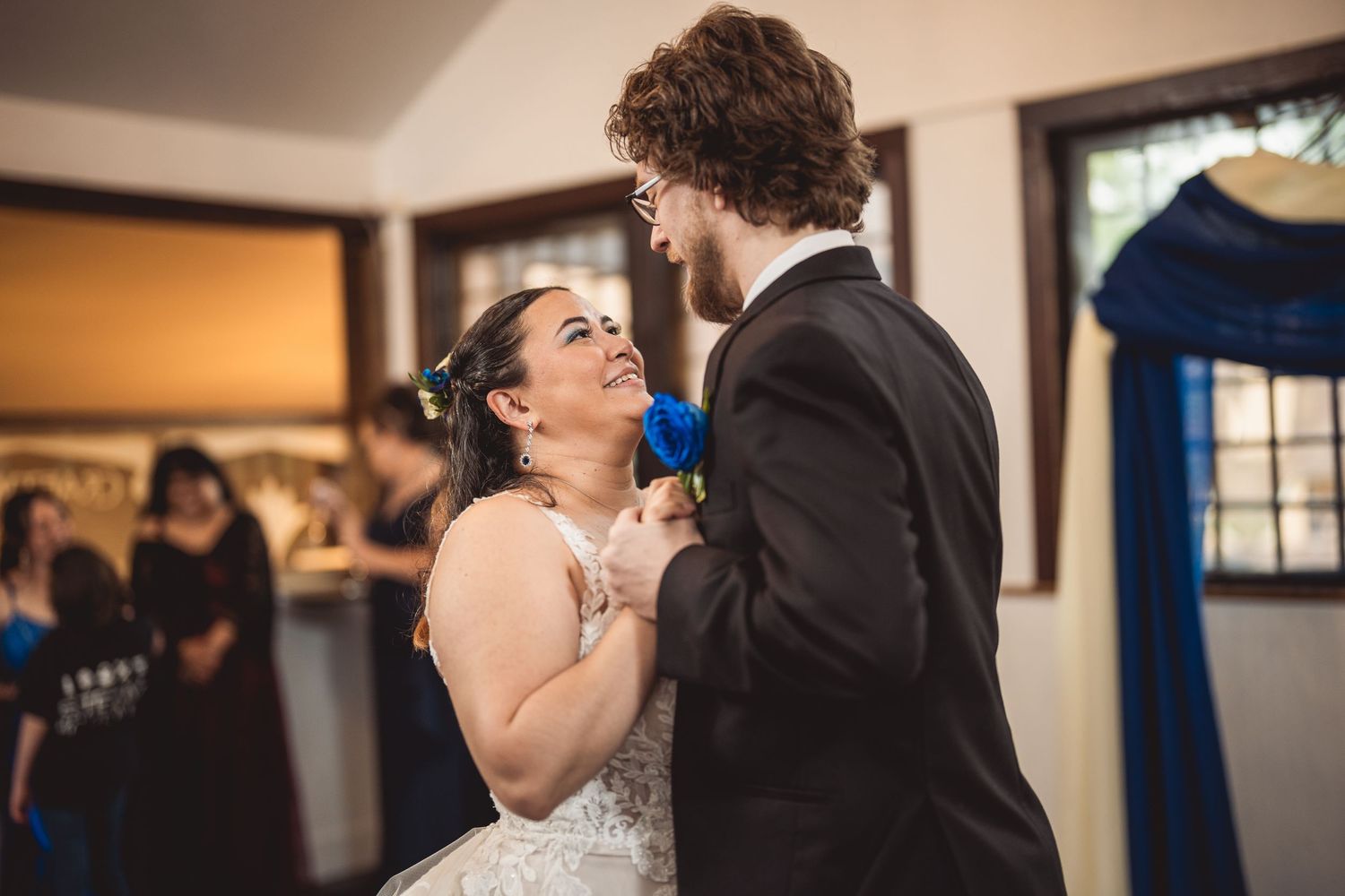 A romantic dance moment captured at an indoor wedding reception.