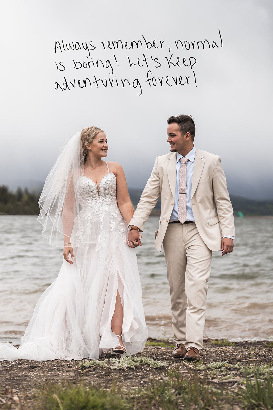 A beach wedding photoshoot with a couple walking along a rocky shoreline in elegant attire.
