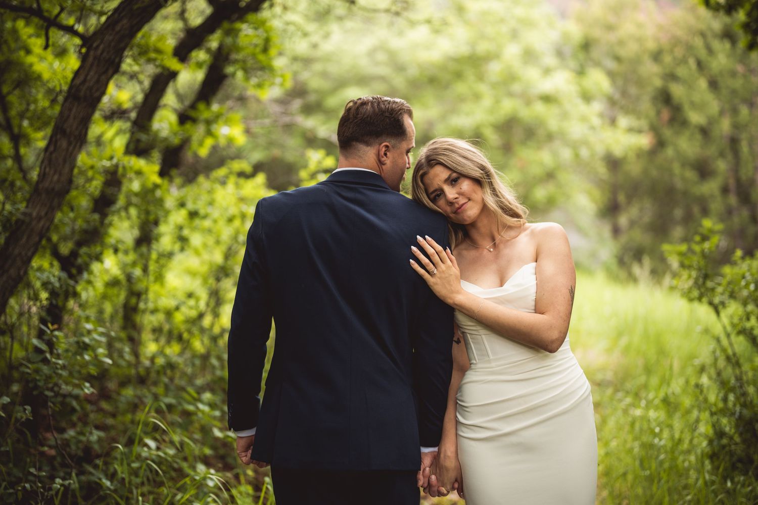 Gentle wedding moments captured in sequence showing affection amid green natural scenery.