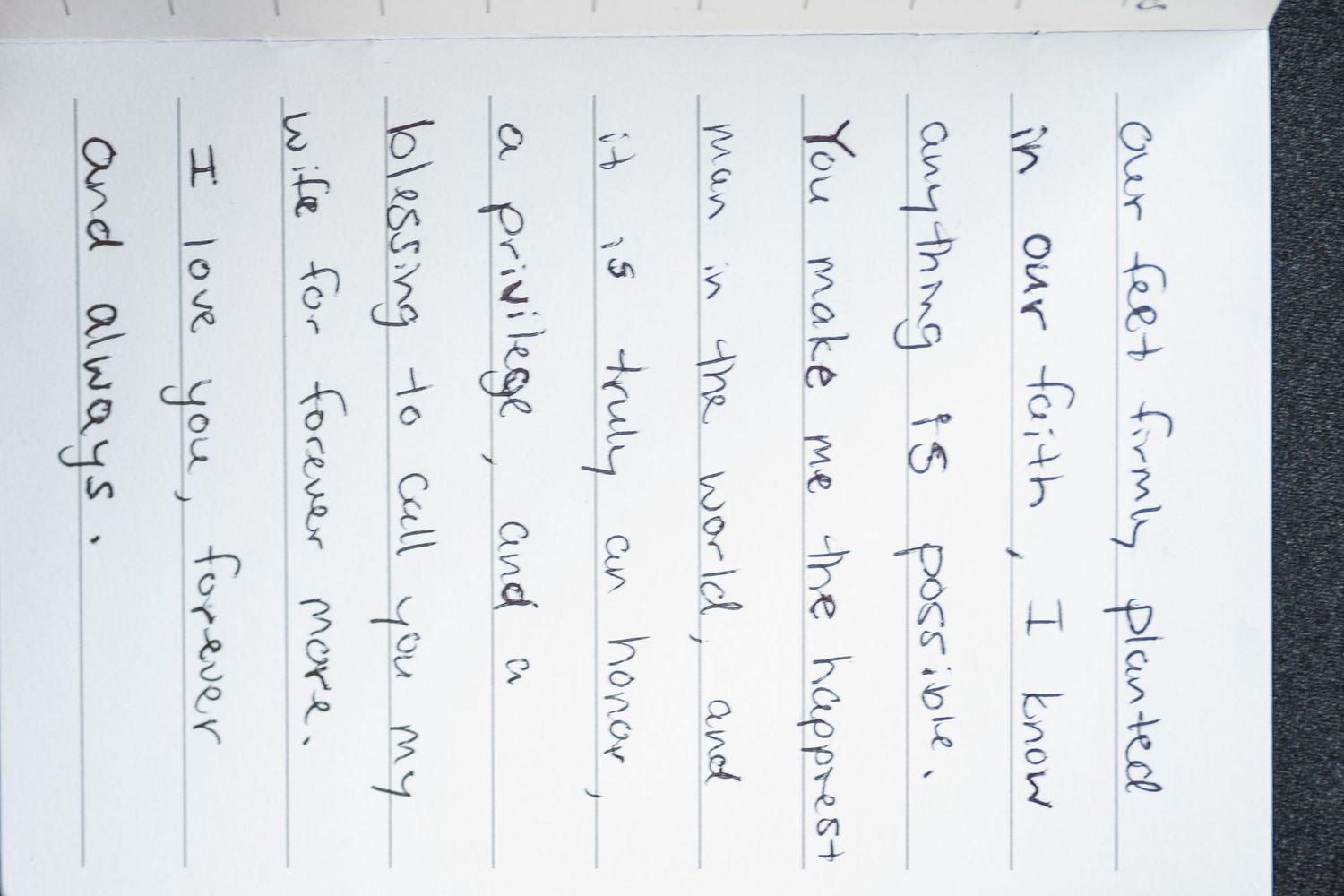 Close-up view of handwritten text on lined paper with personal notes.