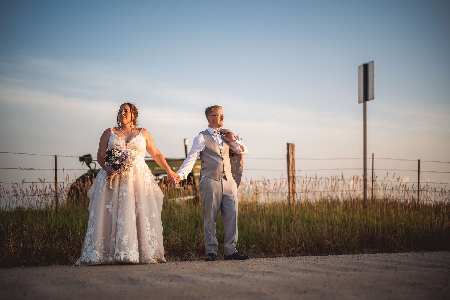 Scenic golden hour wedding portraits in a rustic outdoor setting.