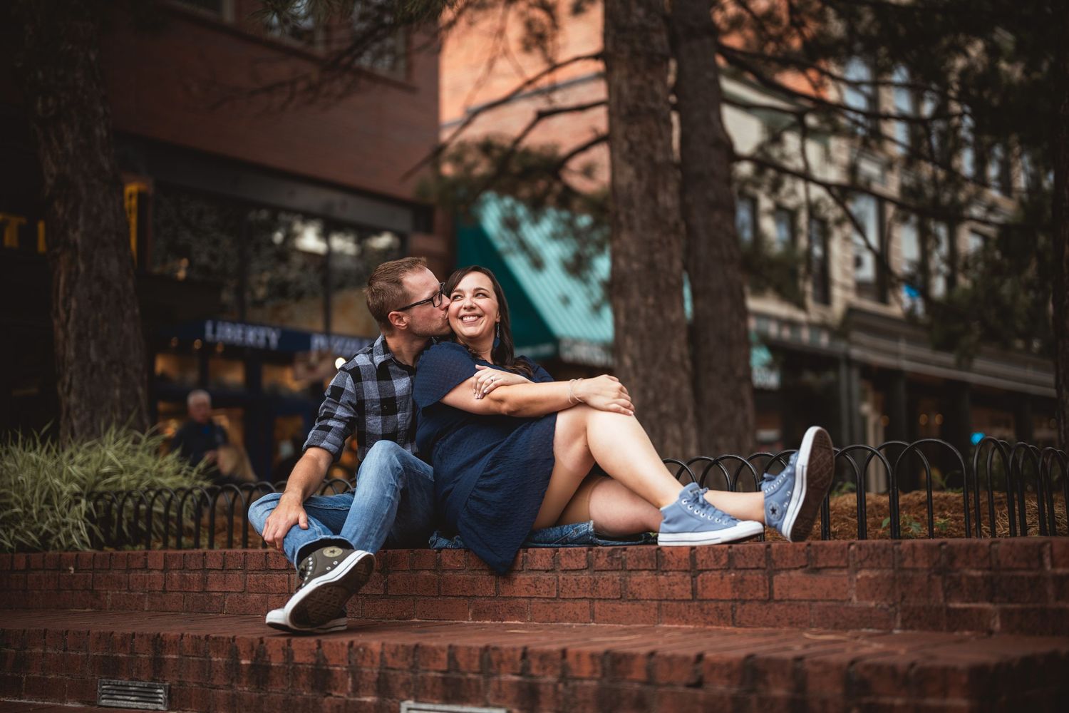 A series of dance-like poses captured on urban steps showing playful movement and connection.