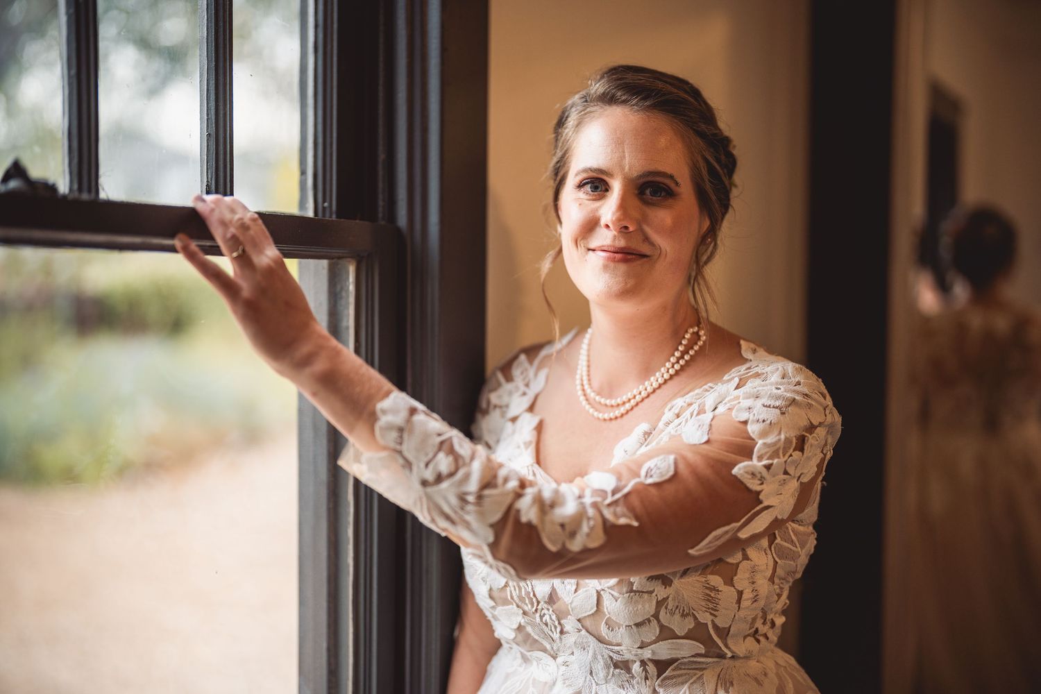 Elegant bridal portrait series showing delicate jewelry and lace details.