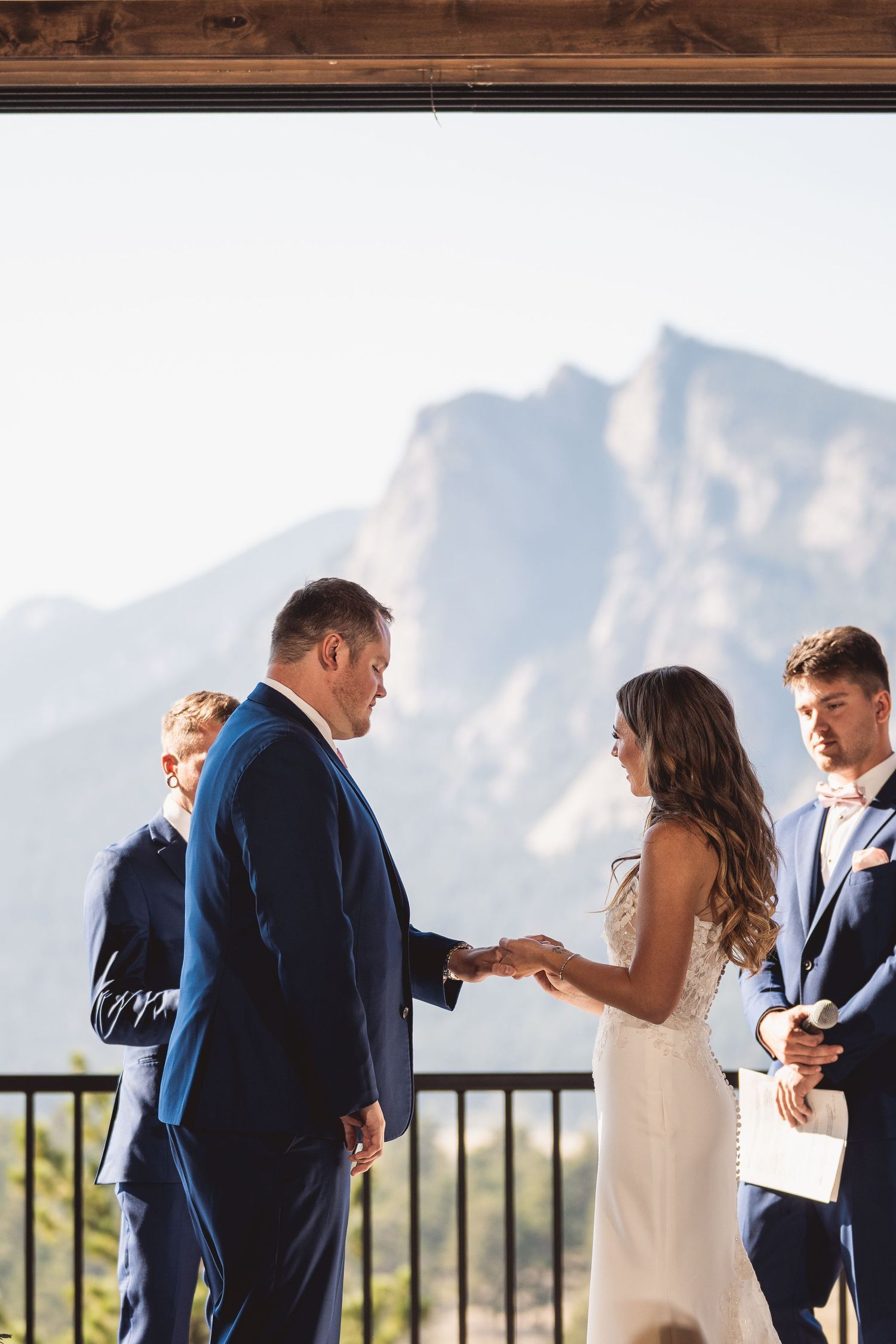 A mountain wedding ceremony with dramatic peaks in the background.