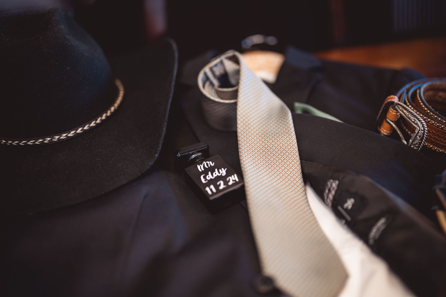 Close-up detail of formal wedding attire accessories.