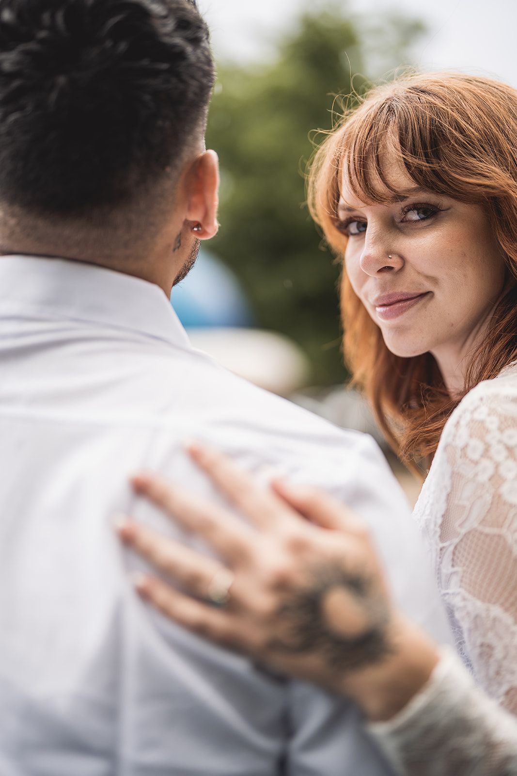 Intimate moment captured through artistic close-up photography with soft lighting.
