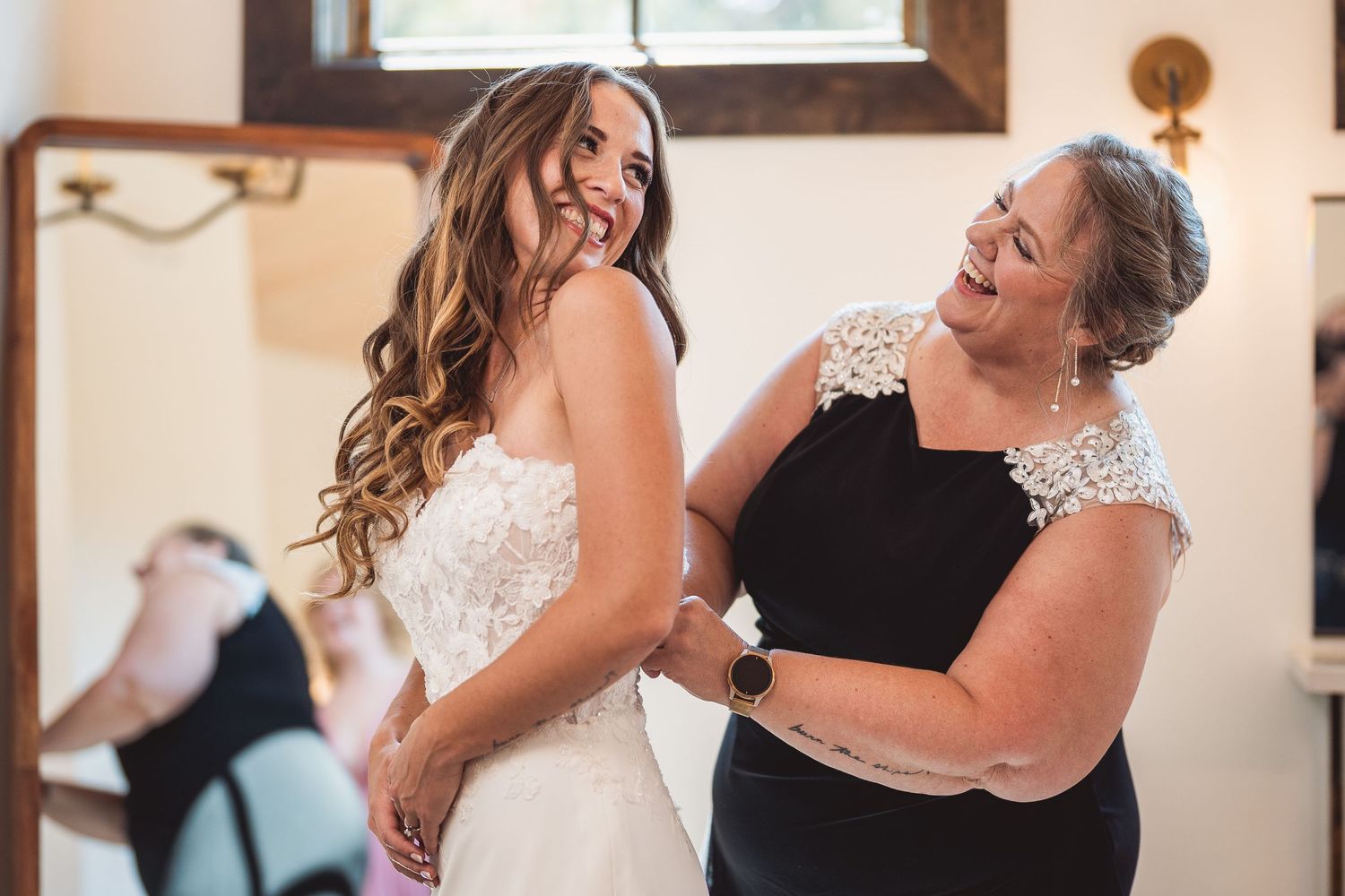 People sharing joyful moments during a wedding celebration.