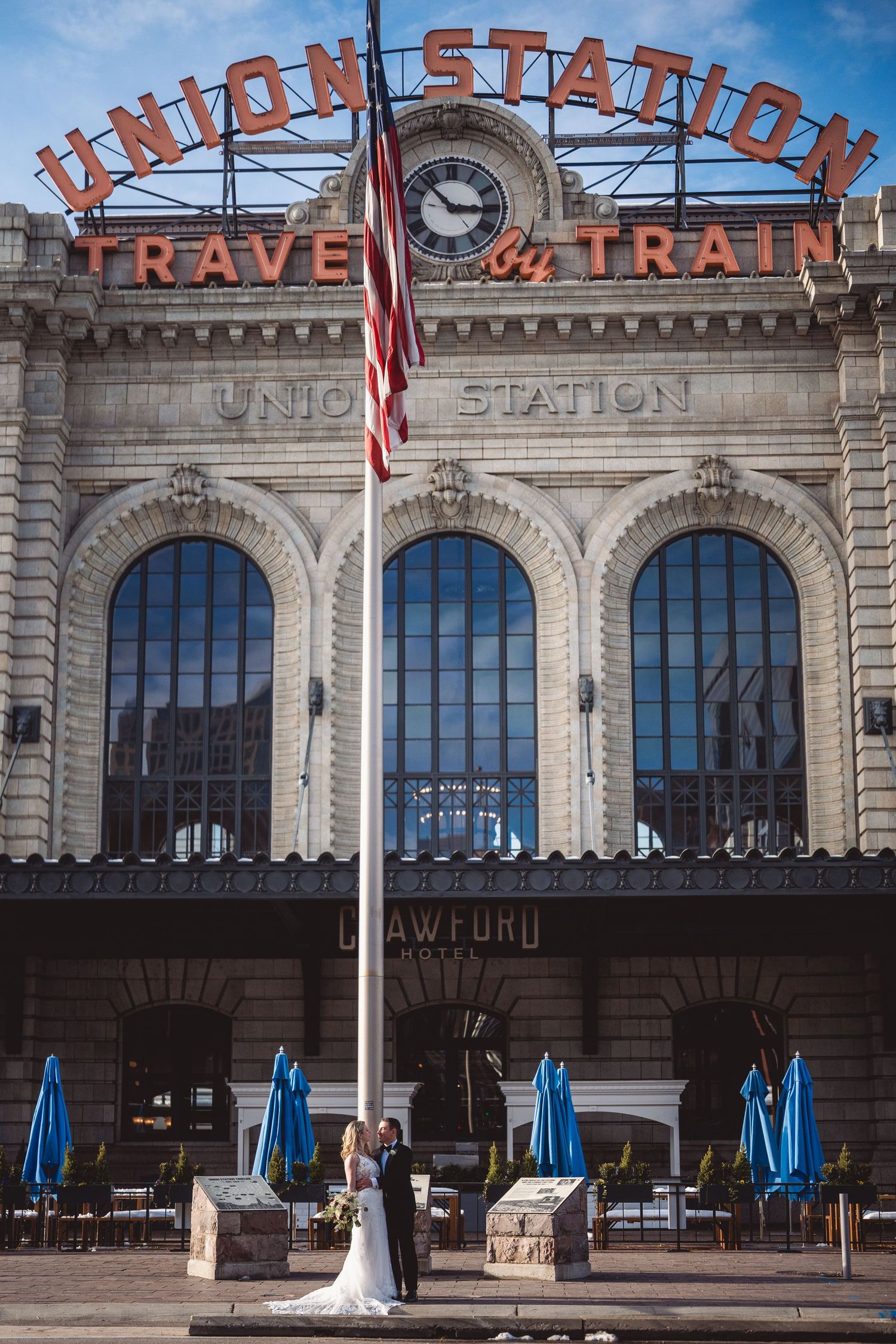 Wide angle view of historic Union Station building facade with classic signage.