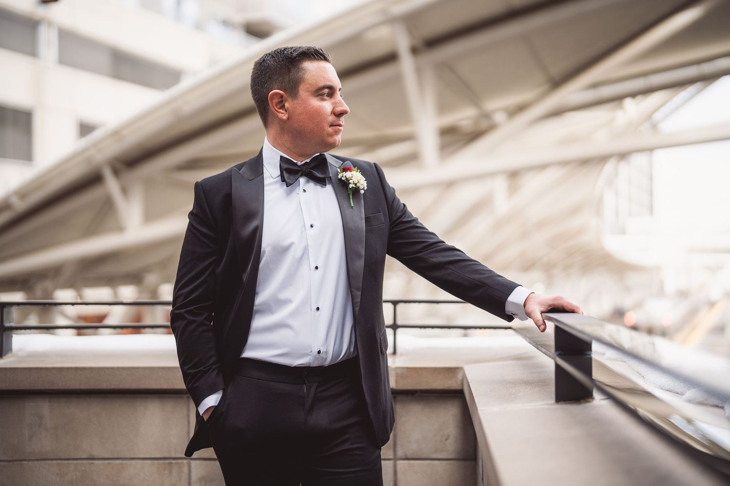 A classic black tuxedo and bowtie portrait sequence showing different poses against a light background.