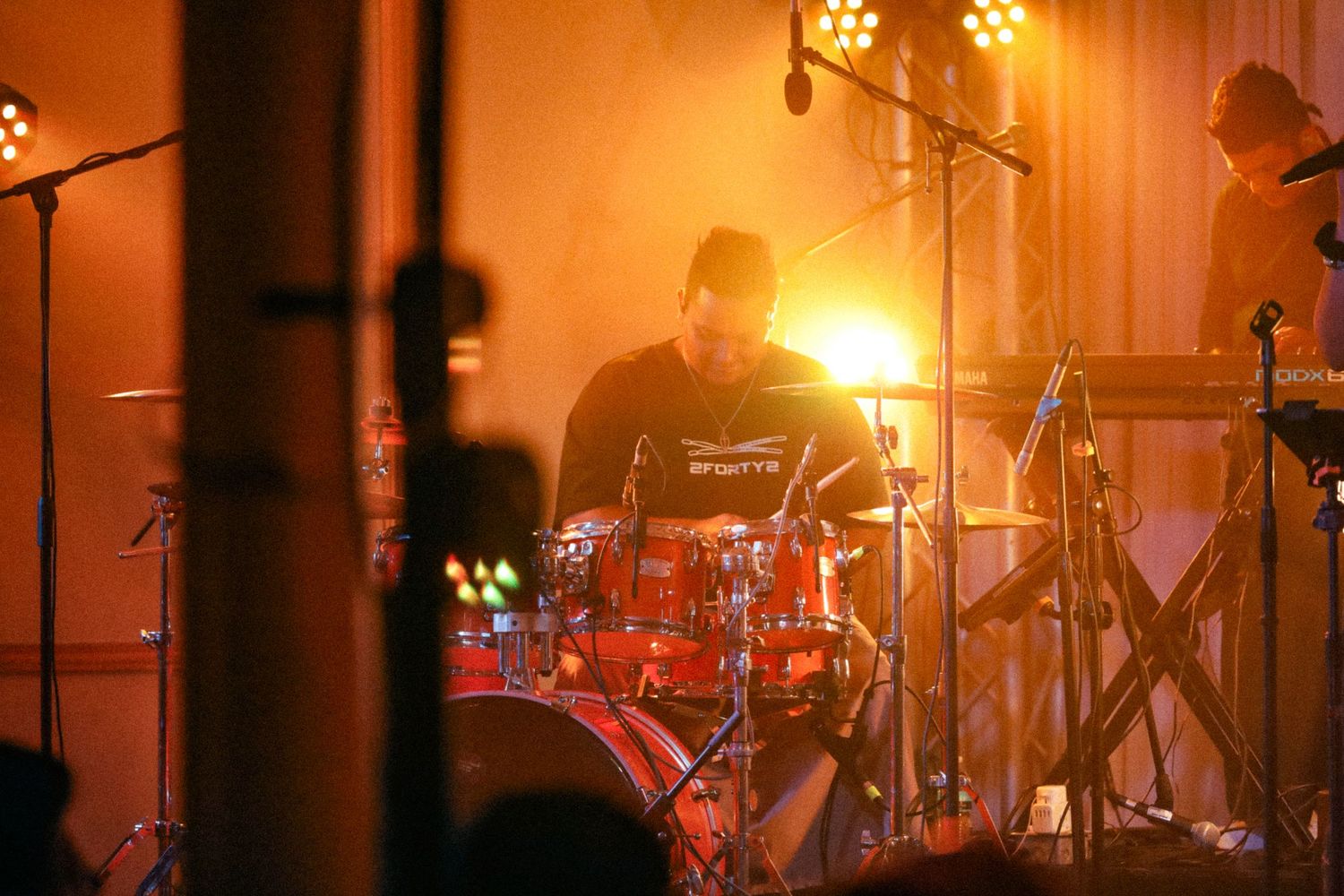 a drummer under light