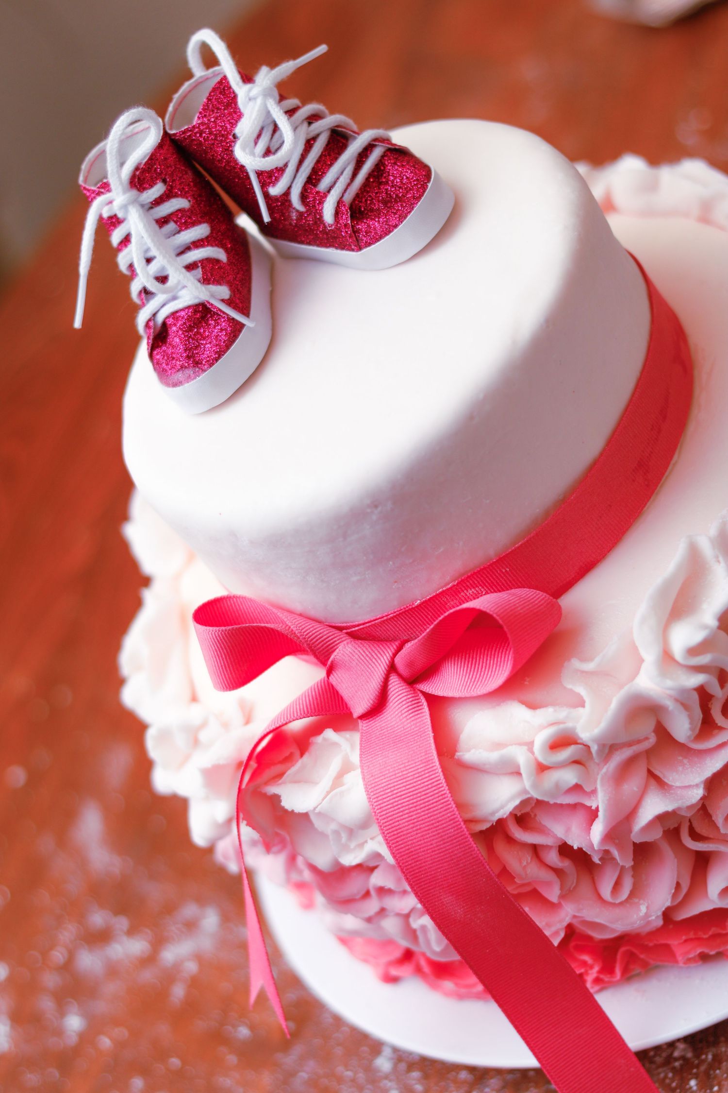Pink and white baby shower cake.