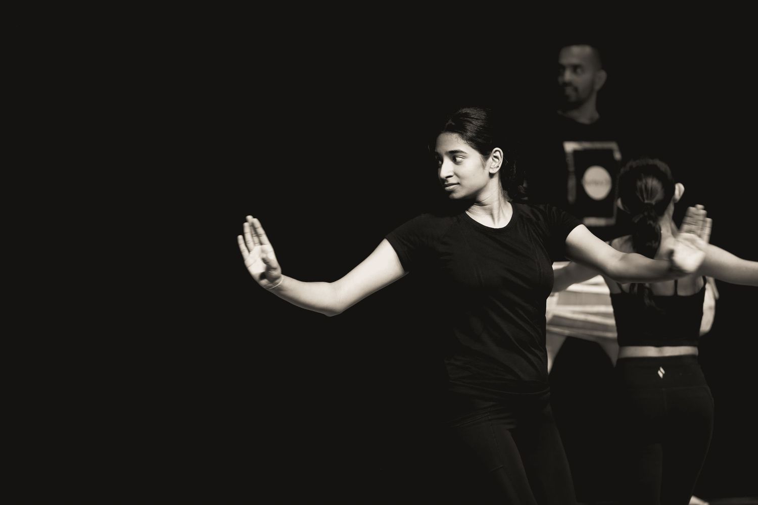 Two traditional dancers. rehearsal. Drummer behind the dancers.