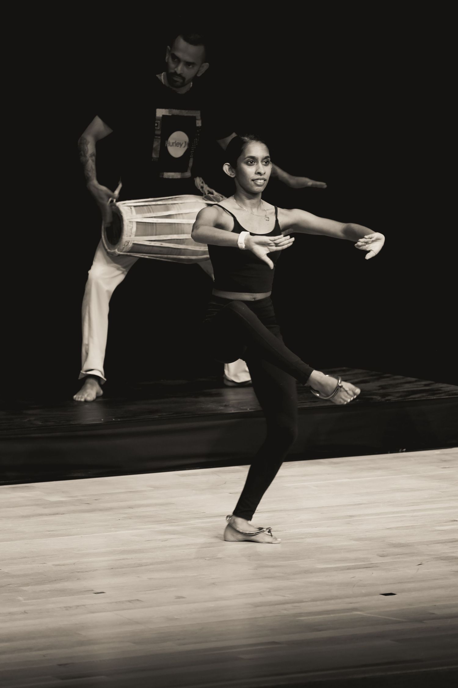 Traditional dancer. Rehearsal. Drummer behind the dancer.