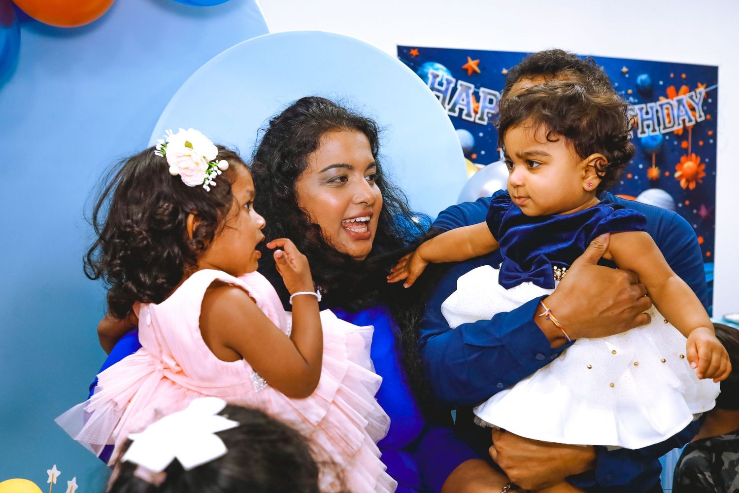 Two kids and a woman