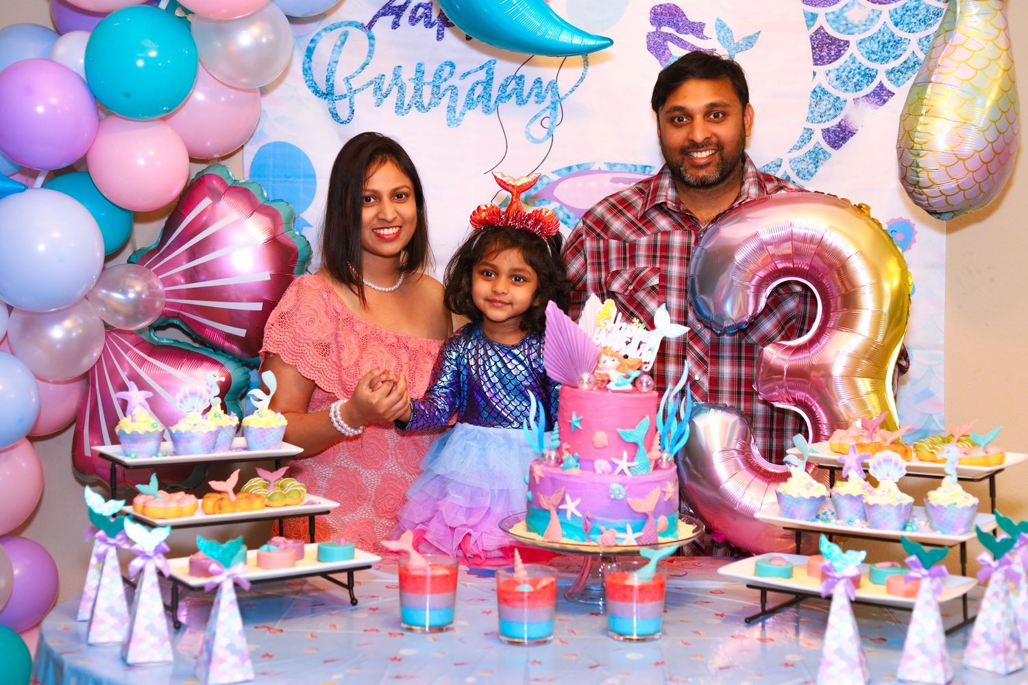 Birthday party family photo of 3.