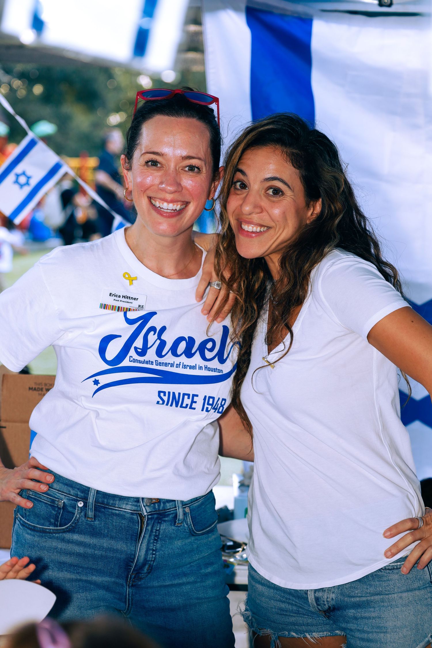 school international festival. Two women posing at country booth