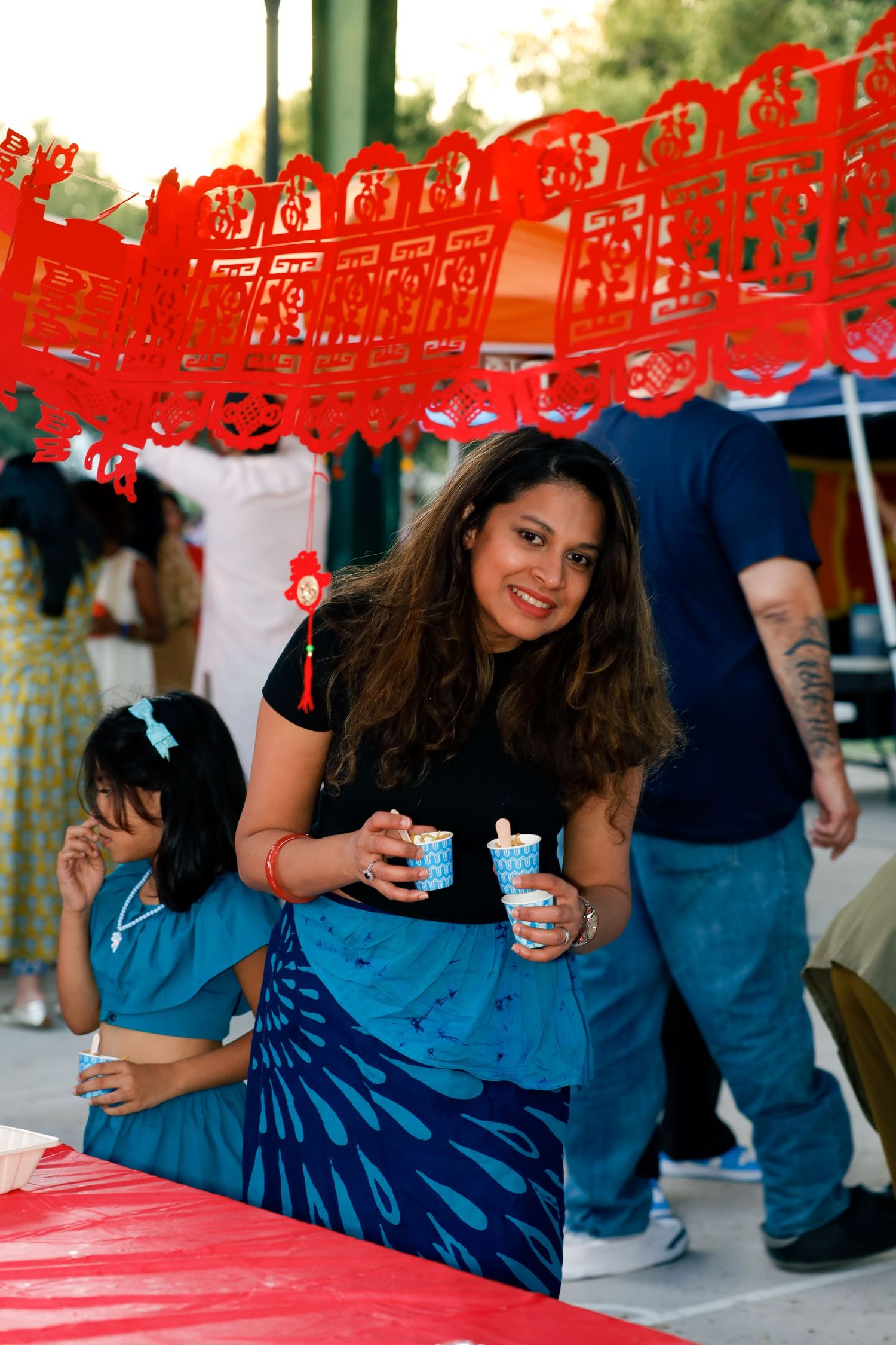 school international festival. a woman standing.