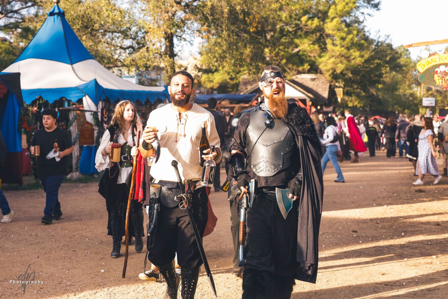 an old England village background. two men wearing costumes