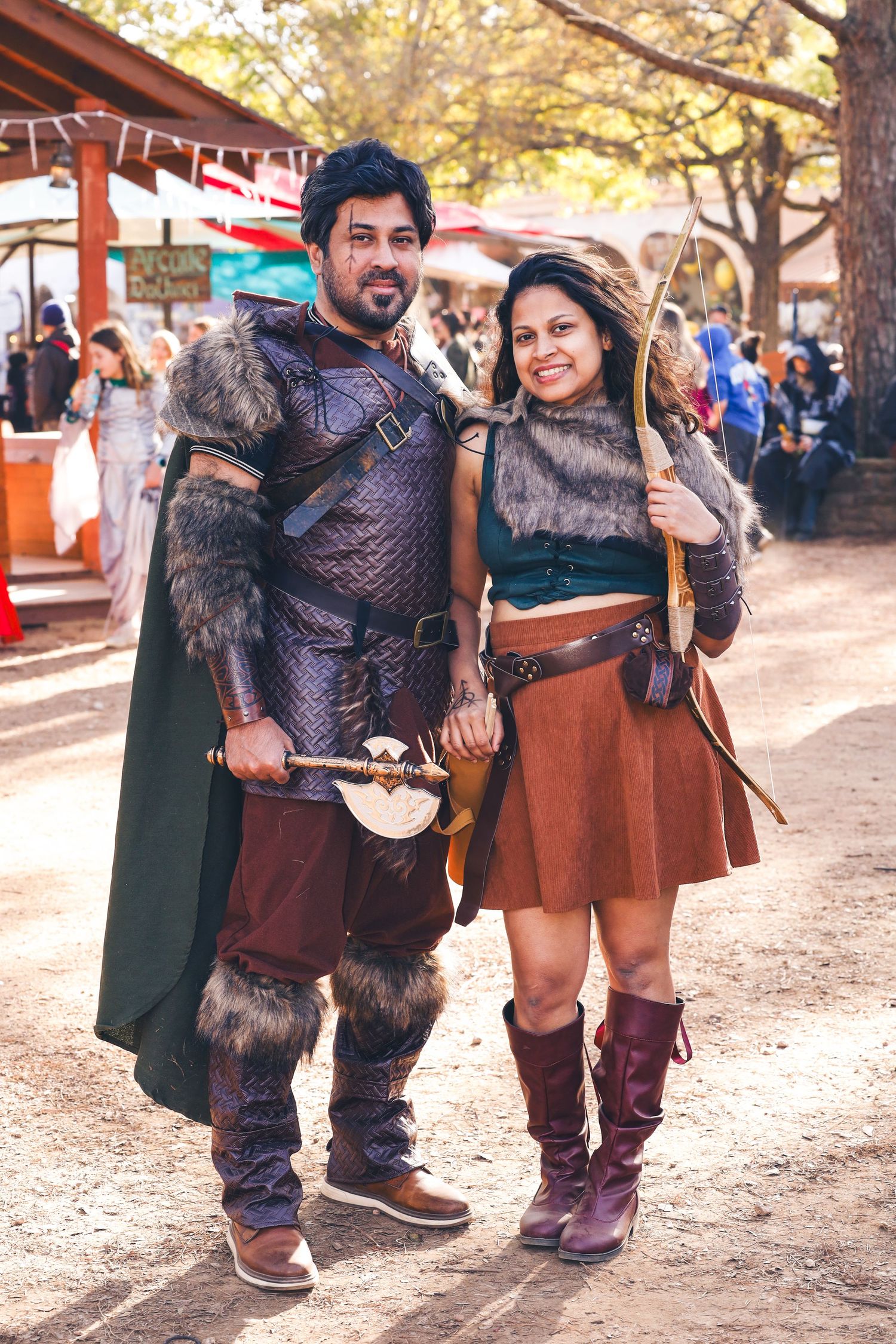 Couple wearing worrier costumes.