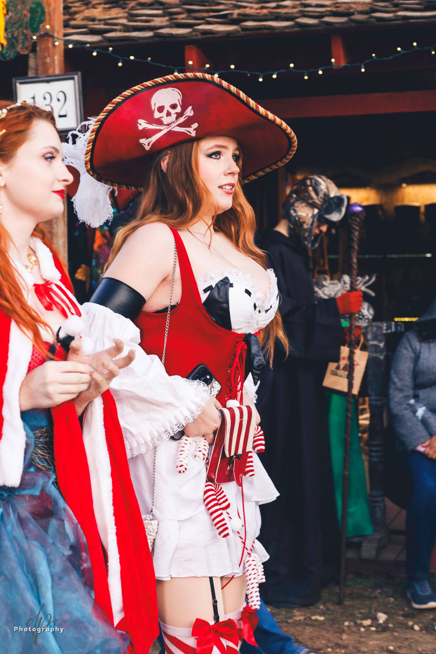 Two women wearing pirate costumes.