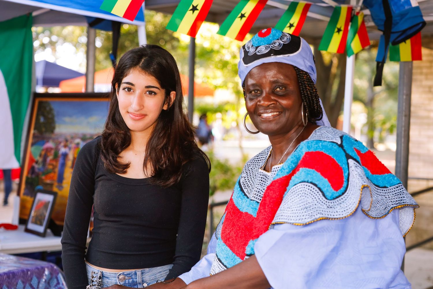 school international festival. country booth two people.