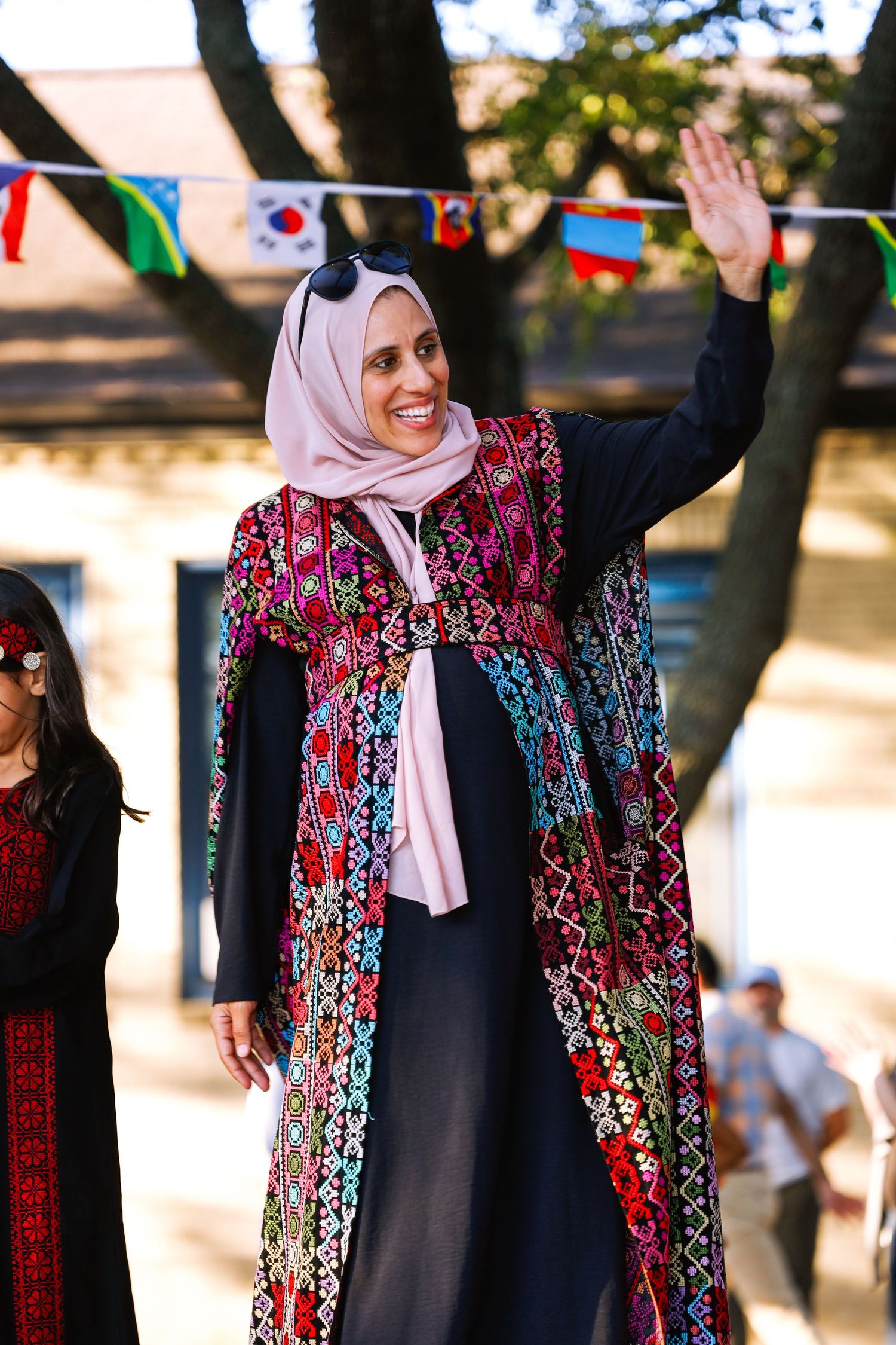 school international festival. a woman waving