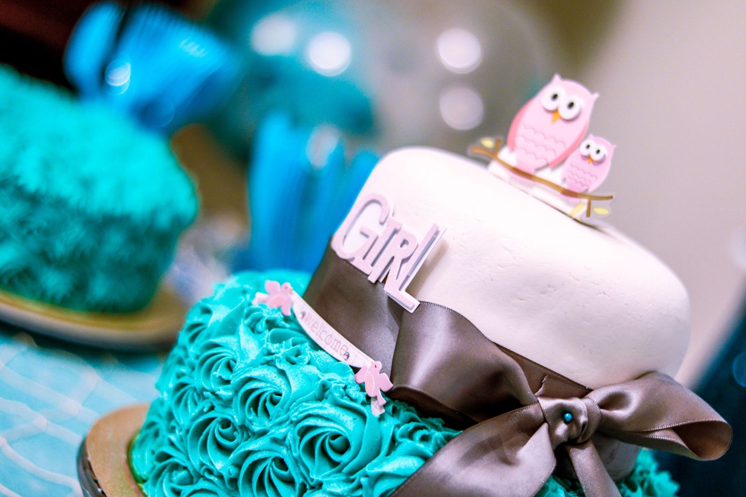 Turquoise and white color baby shower cake.