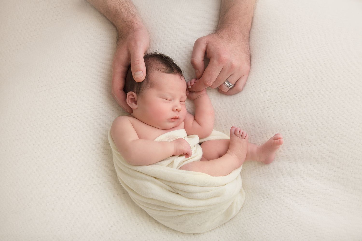 Series of minimalist newborn baby portraits on white background showing tiny details.