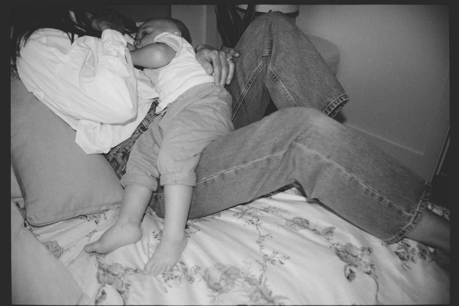 Series of monochrome images showing a person tossing and turning while sleeping in bed.