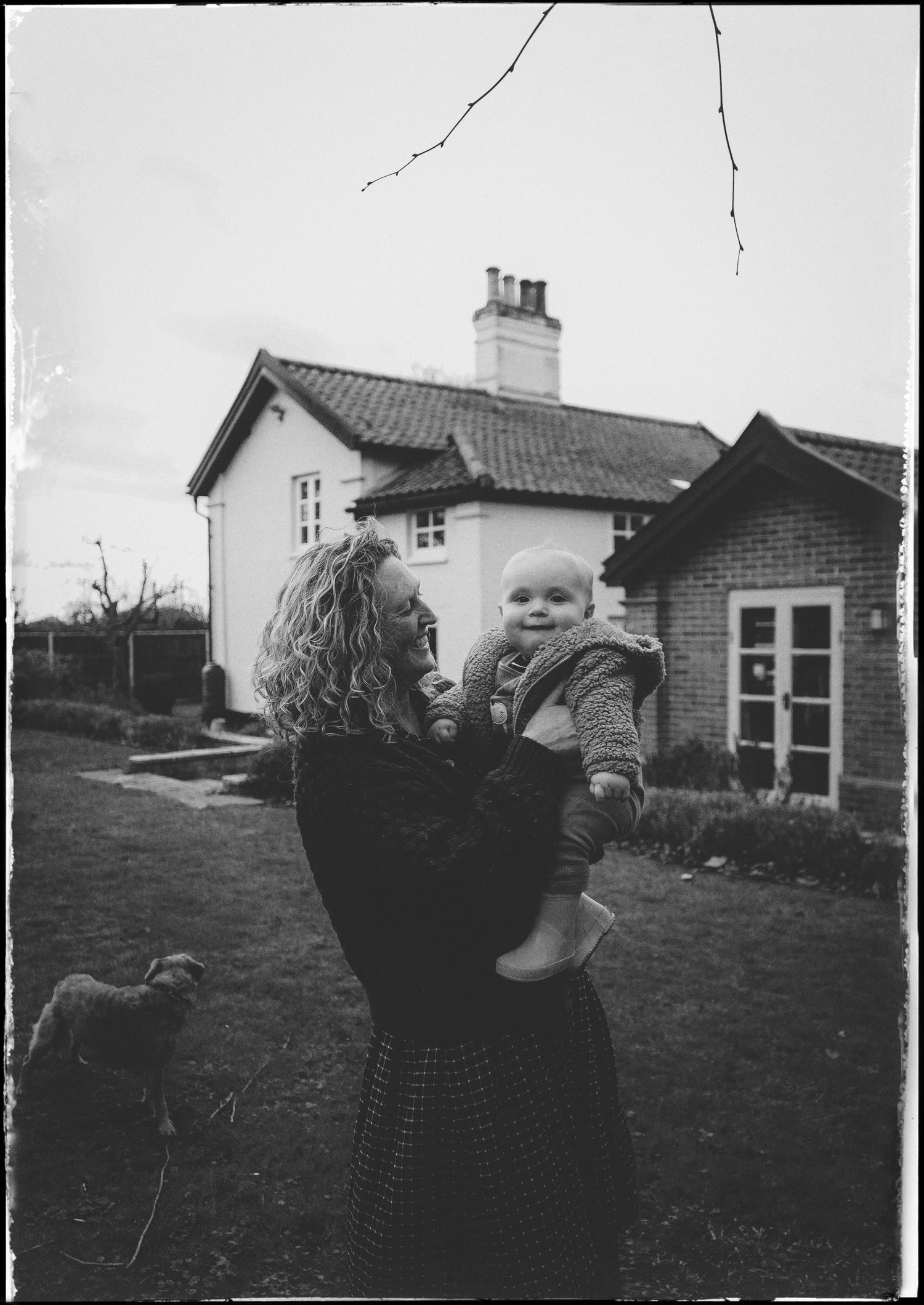 Black and white photos show silhouettes embracing outdoors with a small house and yard visible in the background.