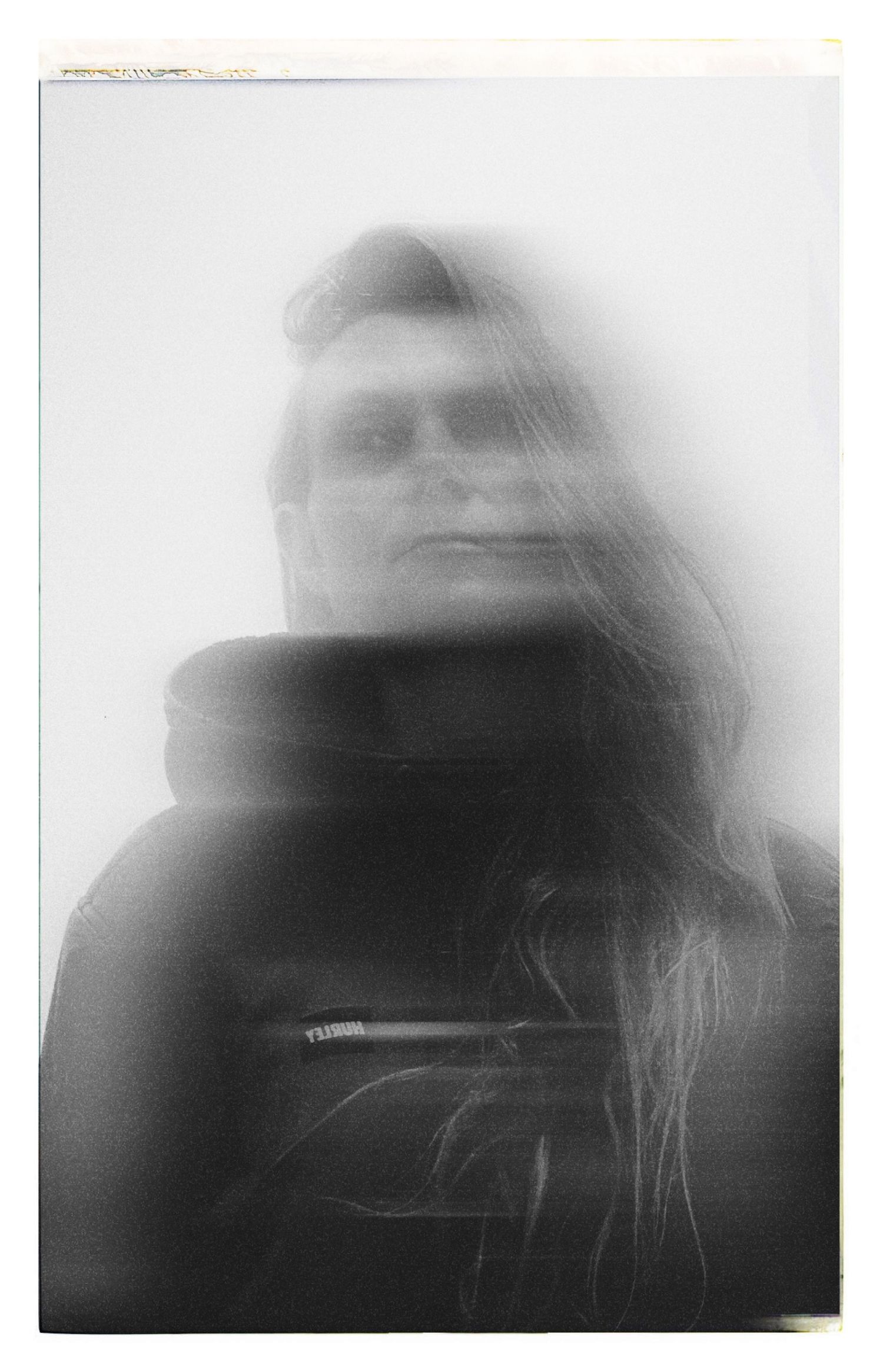 Ethereal foggy portrait in black and white with soft focus effect.