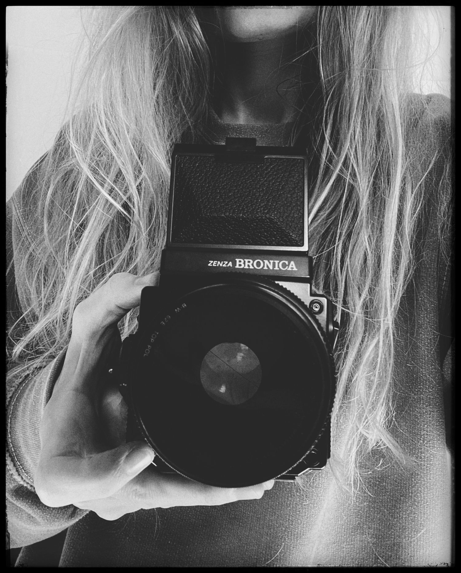 Black and white artistic photo series showing fragments of blonde hair and shadows in moody lighting.