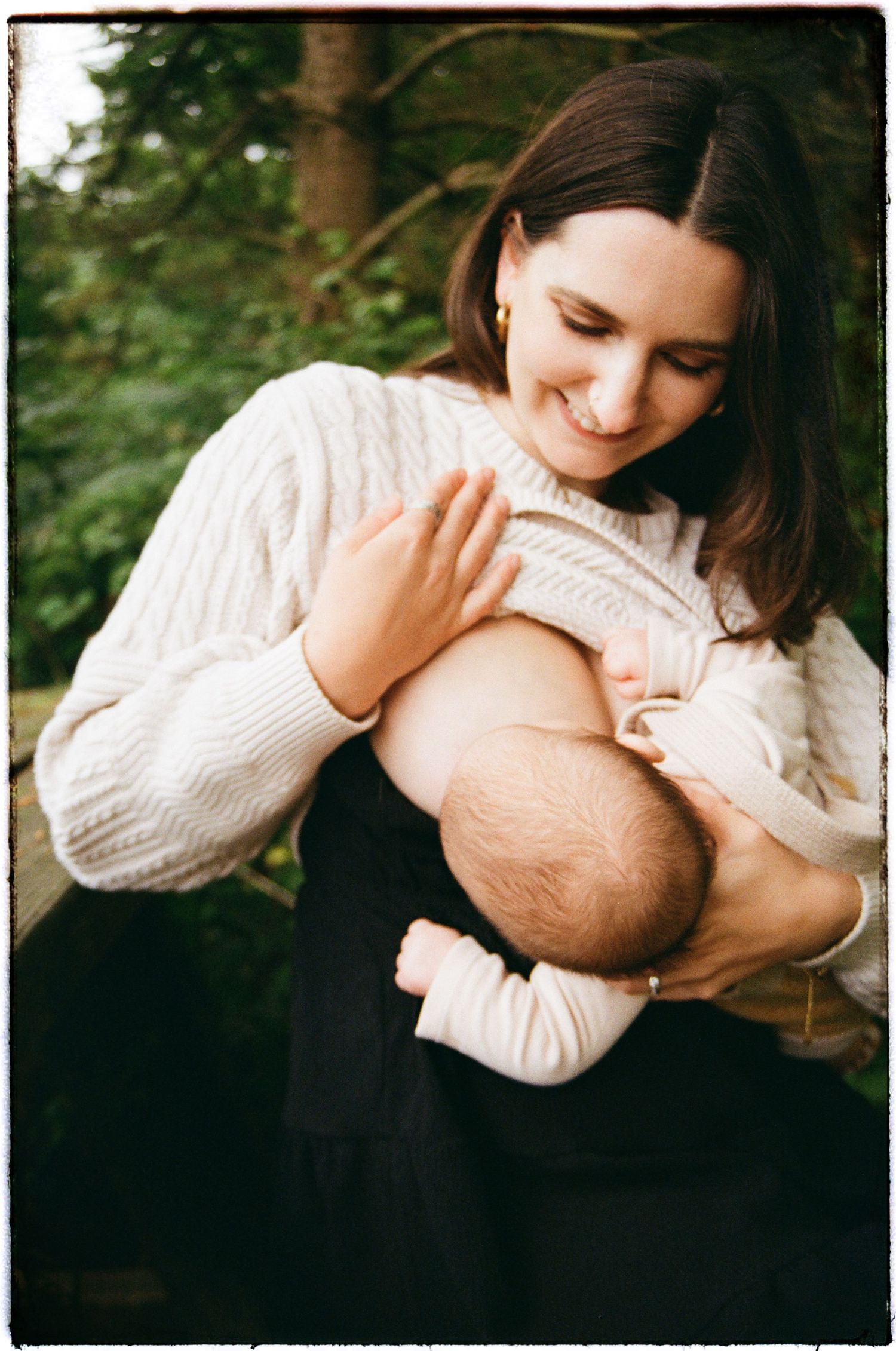 Candid moment of joy and connection captured in warm natural lighting outdoors.