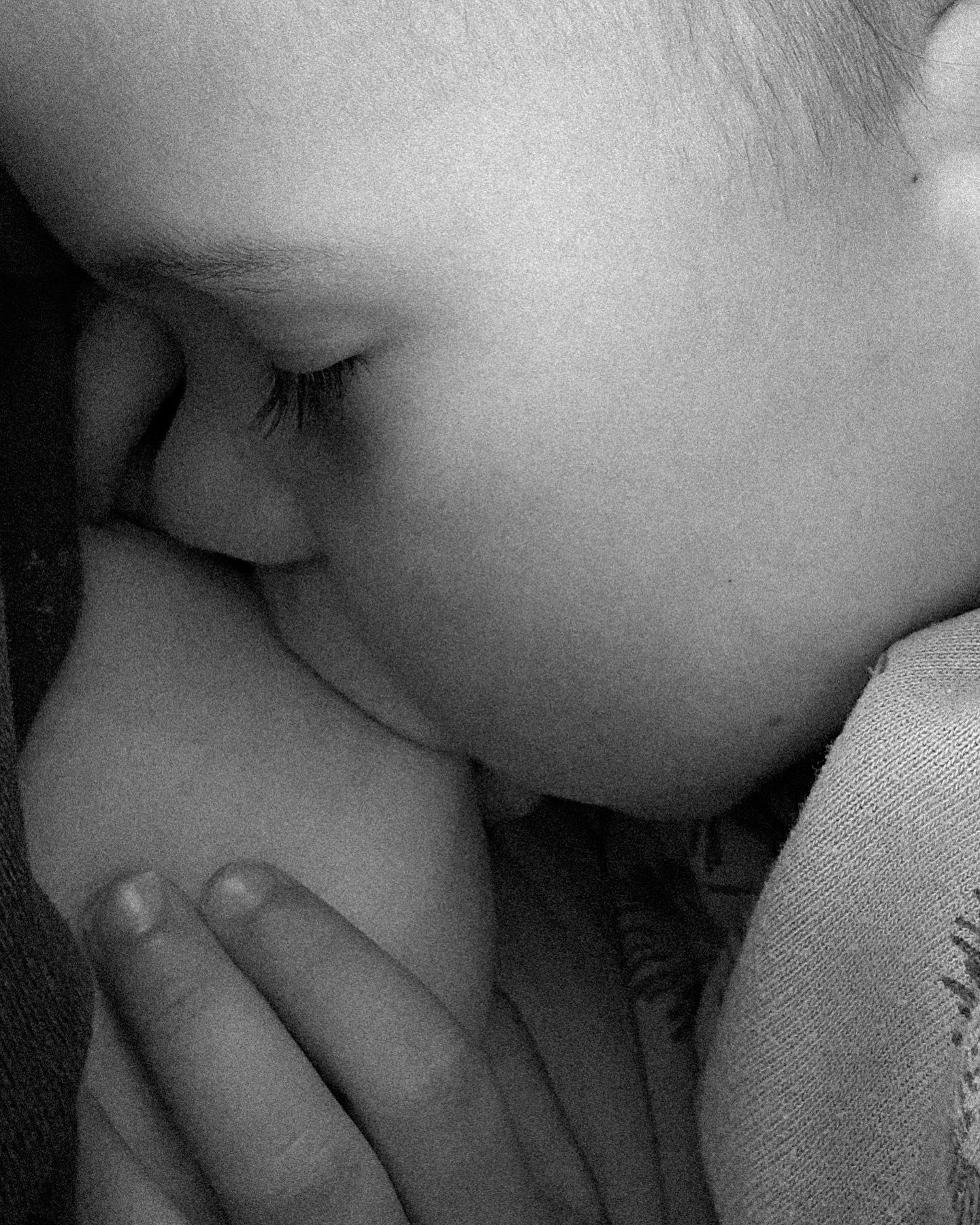 Tender close-up black and white portrait showing gentle intimacy.