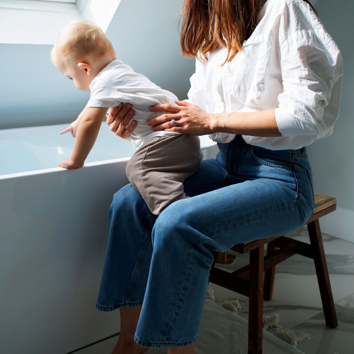A series of motion shots showing someone falling backwards off a chair in a bright room.
