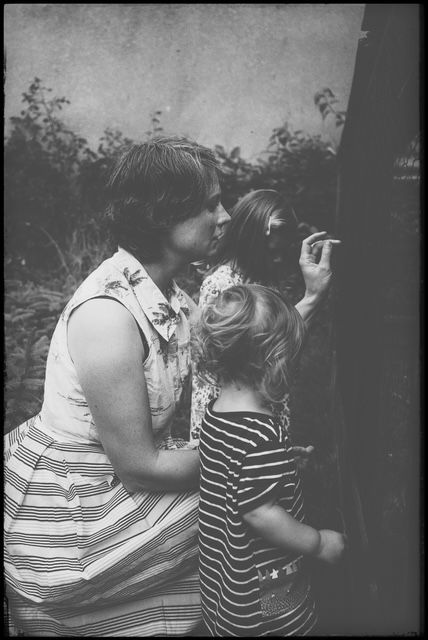 A sequence of black and white photographs showing two people in an intimate embrace.