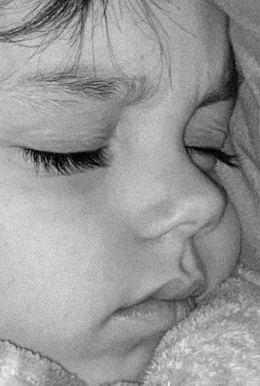 Serene black and white close-up of peaceful sleeping features.