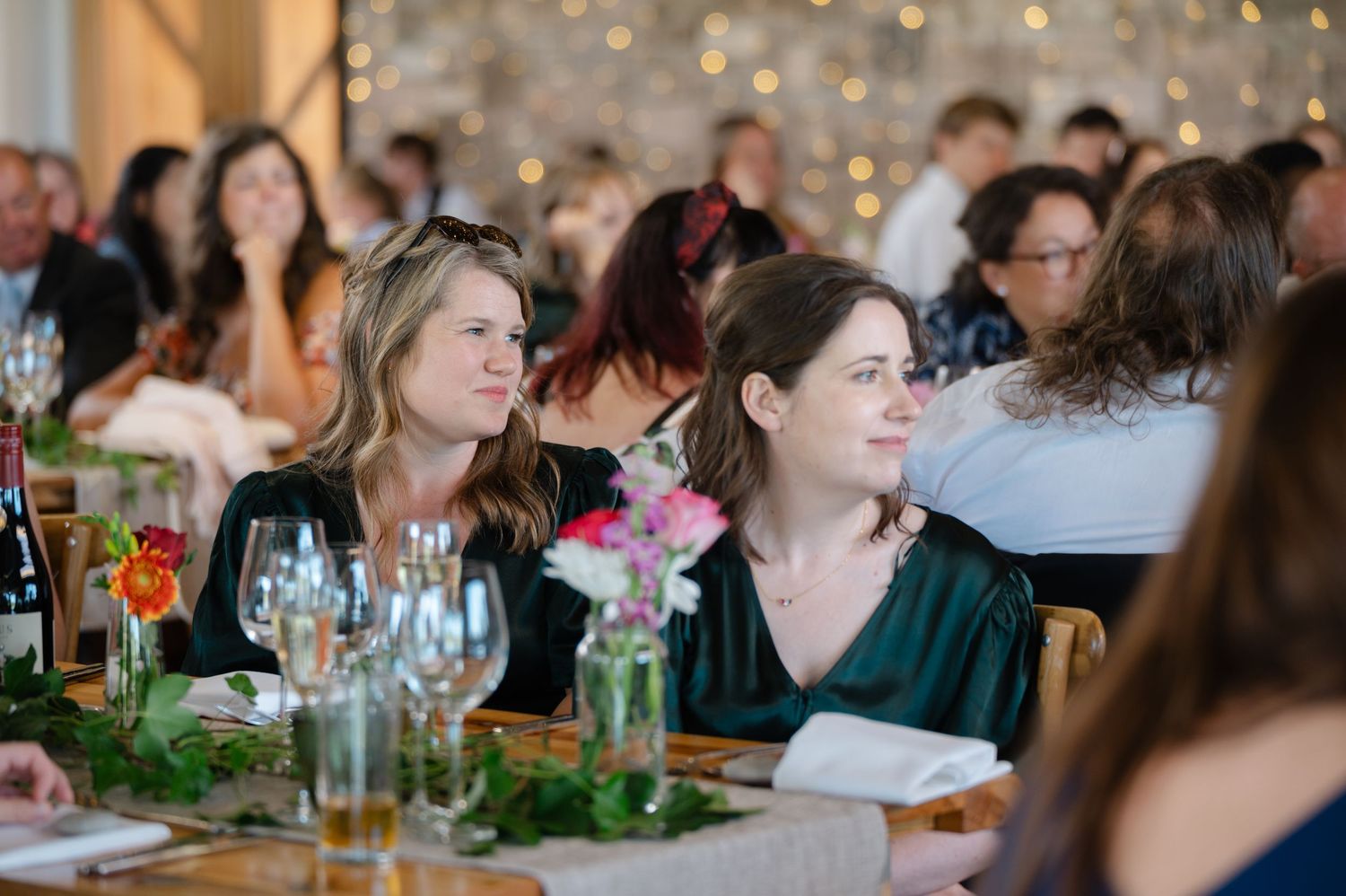 Guests chatting and enjoying drinks during indoor wedding reception
