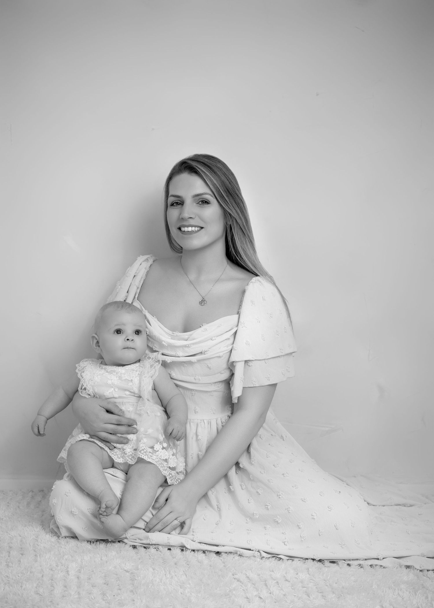 Baby with mum in neutral studio