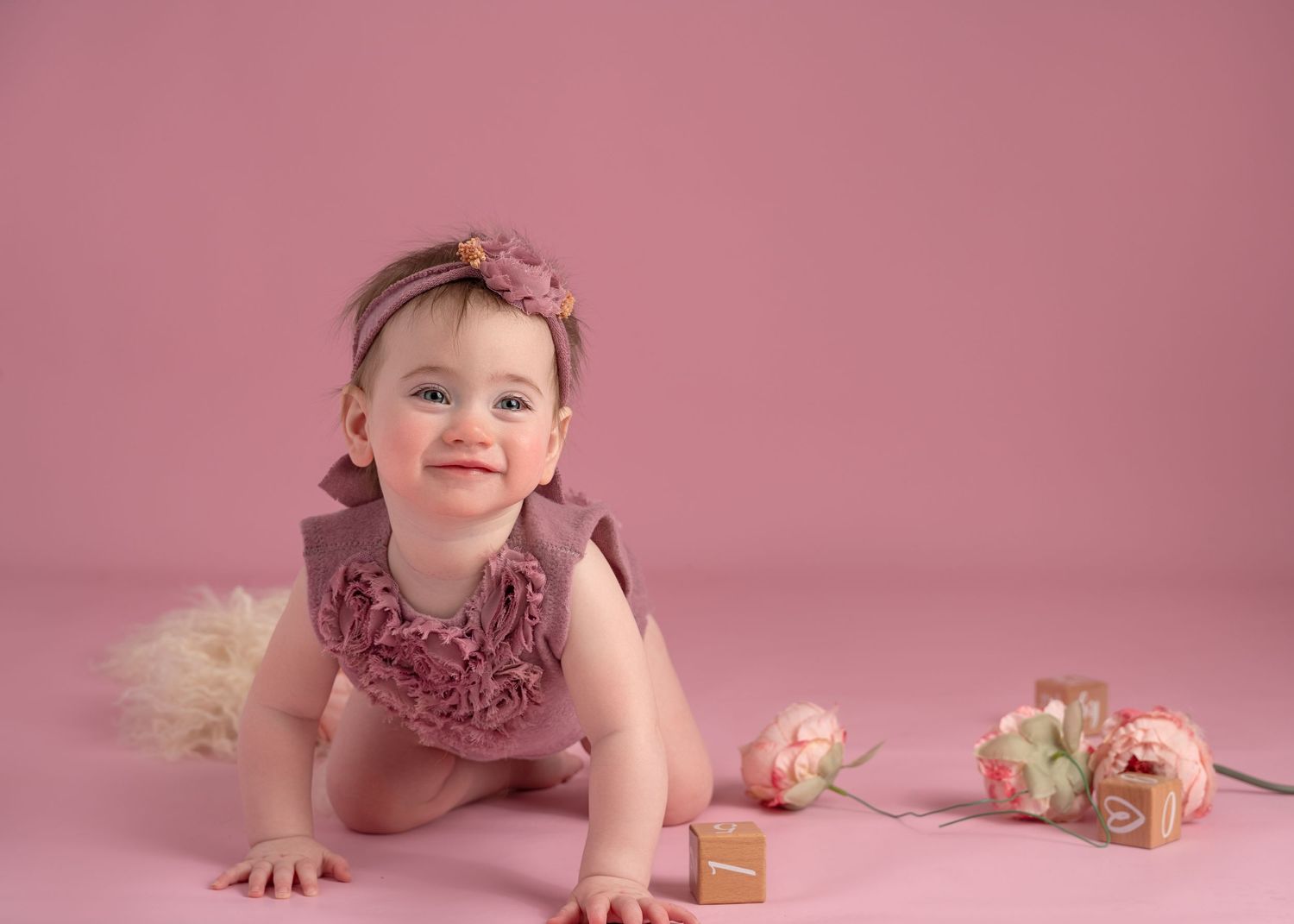 Crawling baby studio portrait