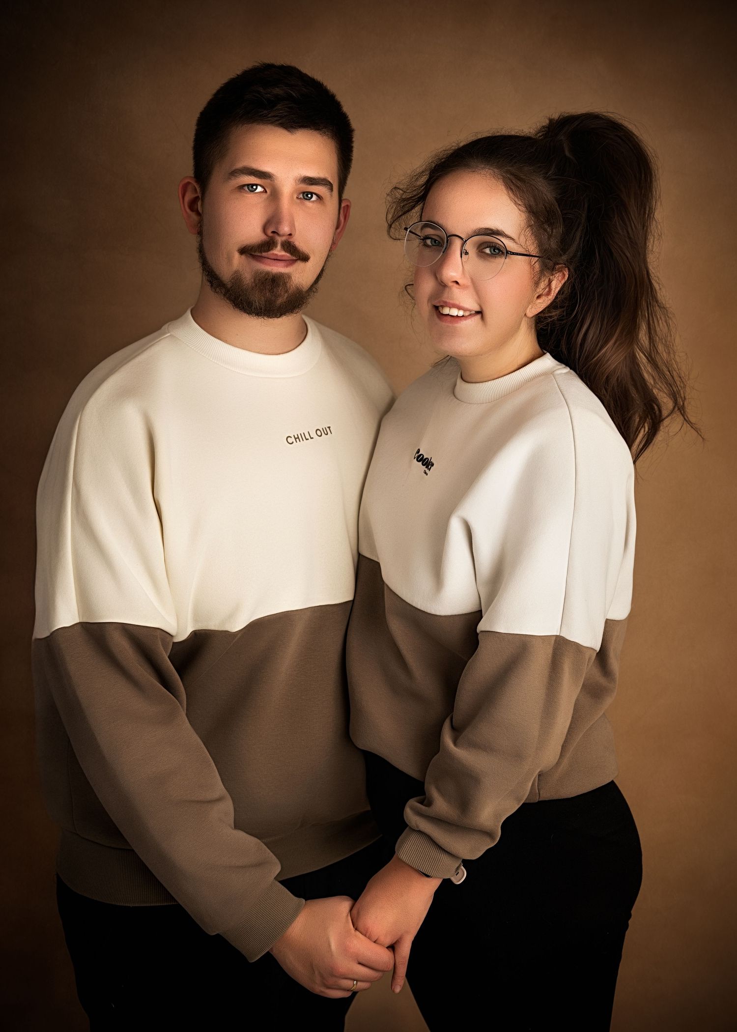 Couple sitting together in a studio portrait